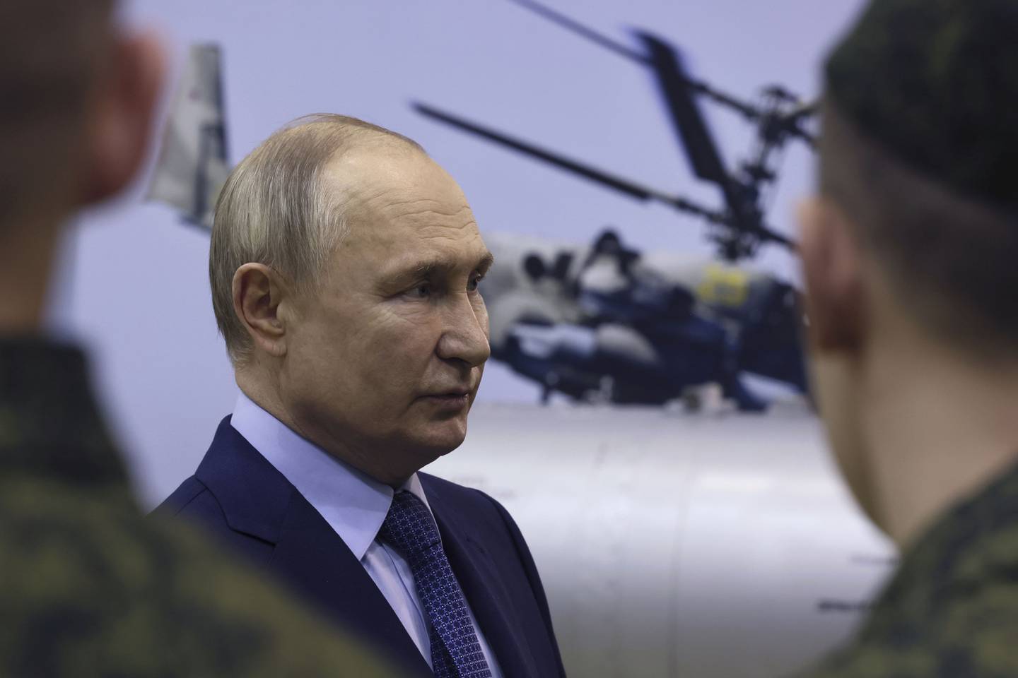 Russian President Vladimir Putin speaks to military pilots while visiting the 344th State Centre for Deployment and Retraining of Flight Personnel of the Russian Defense Ministry in Torzhok, Tver region, 217 km (136 miles) north-west of Moscow, Russia, Wednesday, March 27, 2024. (Mikhail Metzel, Sputnik, Kremlin Pool Photo via AP)