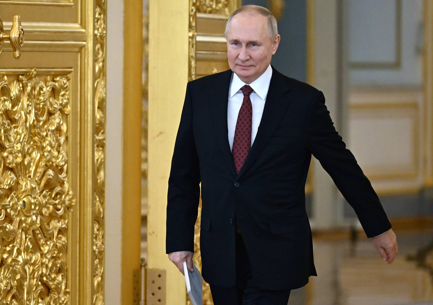 Russian President Vladimir Putin arrives for a ceremony to receive credentials from newly arrived foreign ambassadors at the Alexander Hall of the Grand Kremlin Palace in Moscow, Russia, Monday, Dec. 4, 2023. (Pavel Bednyakov, Sputnik, Kremlin Pool Photo via AP)