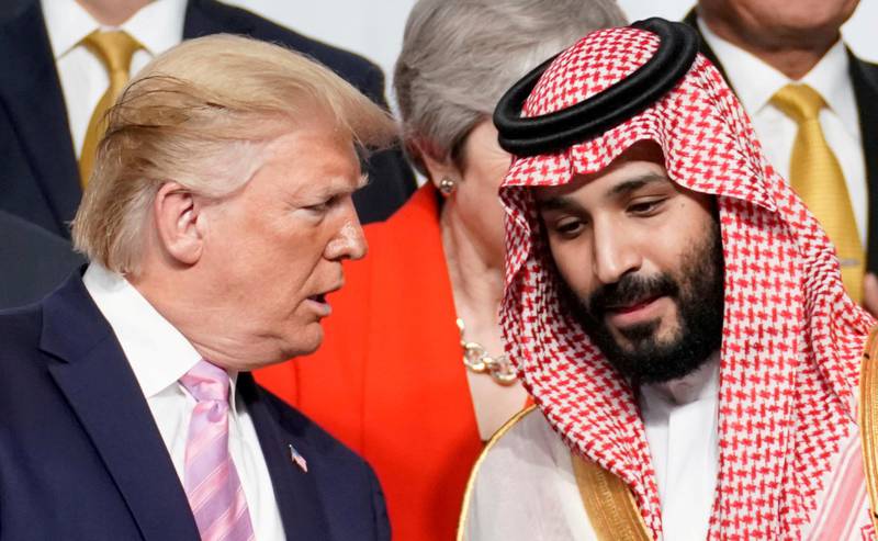 FILE PHOTO: U.S. President Donald Trump speaks with Saudi Arabia's Crown Prince Mohammed bin Salman during family photo session with other leaders and attendees at the G20 leaders summit in Osaka, Japan, June 28, 2019.  REUTERS/Kevin Lamarque/File Photo