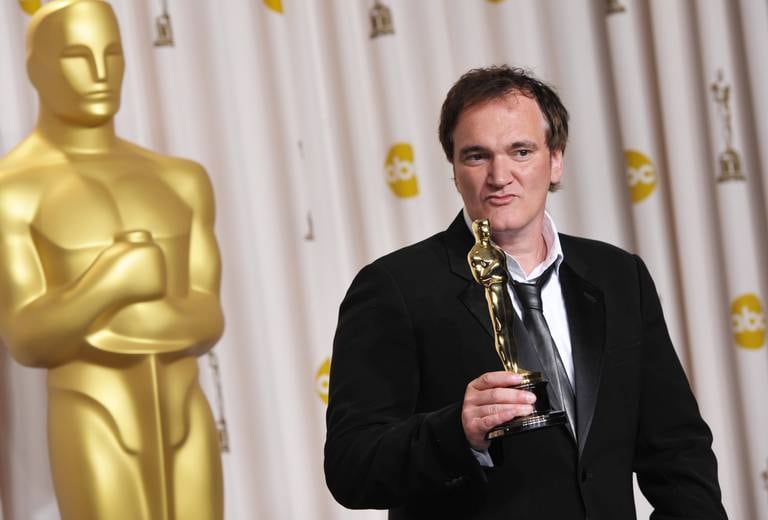 Quentin Tarantino poses with his award for best original screenplay for "Django Unchained" during the Oscars at the Dolby Theater on Sunday Feb.  24, 2013, in Los Angeles.  (Photo by John Shearer/Invision/AP)