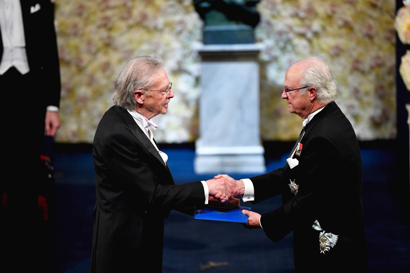 Austrian author Peter Handke, left, receives the 2019 Nobel Prize from King Carl Gustaf of Sweden, during the Nobel Prize award ceremony at the Stockholm Concert Hall, in Stockholm, Tuesday, Dec. 10, 2019. (Henrik Montgomery/TT News Agency via AP)