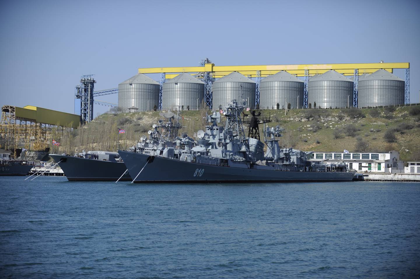 FILE - In this Monday, March 31, 2014 file photo Russian Black Sea fleet ships are anchored in one of the bays of Sevastopol, Crimea. With hundreds of new aircraft, tanks and missiles rolling off assembly lines and Russian jets buzzing European skies under NATOs wary eye, it doesnt look like Russias economic woes have had any impact on the Kremlins ambitious military modernization program. (AP Photo/Andrew Lubimov, File)