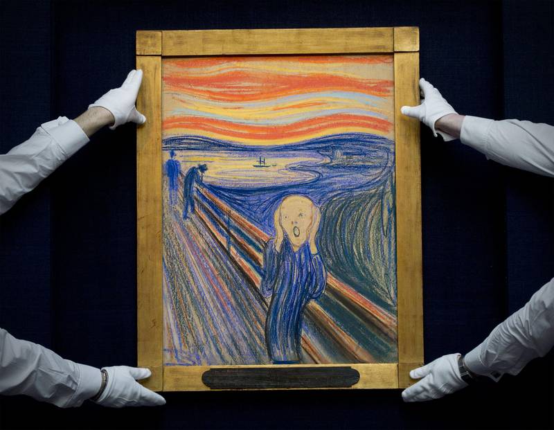 (FILES)Sotheby's employees pose with Norwegian artist Edvard Munch's 1895 pastel on board version of 'The Scream' at Sotheby's auction house in central London in this April 12, 2012 file photo. The only privately owned version of Edvard Munch's "The Scream" -- one of the most recognizable paintings in history -- set a world record on May 2, 2012 when it sold for $119.9 million at Sotheby's in New York. Heated competition between seven bidders took the price to the highest for a work of art at auction in just 12 minutes, sparking applause. AFP PHOTO / CARL COURT