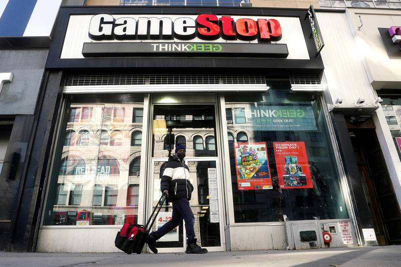 FILE PHOTO: A person walks past a GameStop store in the Manhattan borough of New York City, New York, U.S., January 29, 2021. REUTERS/Carlo Allegri/File Photo