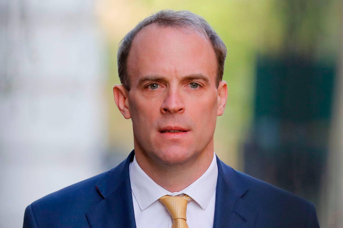 Britain's Foreign Secretary Dominic Raab arrives in Downing Street in central London on April 7, 2020 after the prime minister was moved to intensive care with a worsening case of of COVID-19. - The British prime minister spent the night in intensive care after being admitted with a deteriorating case of coronavirus, prompting serious concerns on Tuesday about his health and the government's response to a still-escalating outbreak. The prime minister asked Foreign Secretary Dominic Raab to deputise for him shortly before he was moved to the intensive care unit of London's St Thomas' Hospital on Monday evening. (Photo by Tolga AKMEN / AFP)