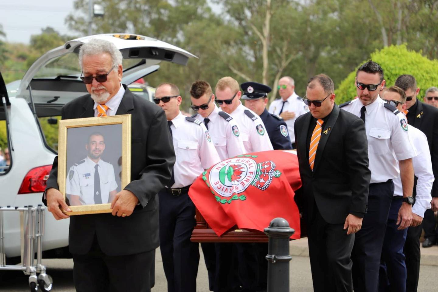 Crew from the Horsley Park RFS carry the casket of NSF RFS volunteer Andrew O'Dwyer during his funeral service in Sydney, Australia, January 7, 2020 in this picture obtained from social media. NSW Rural Fire Service /via REUTERS THIS IMAGE HAS BEEN SUPPLIED BY A THIRD PARTY. MANDATORY CREDIT. NO RESALES. NO ARCHIVES.