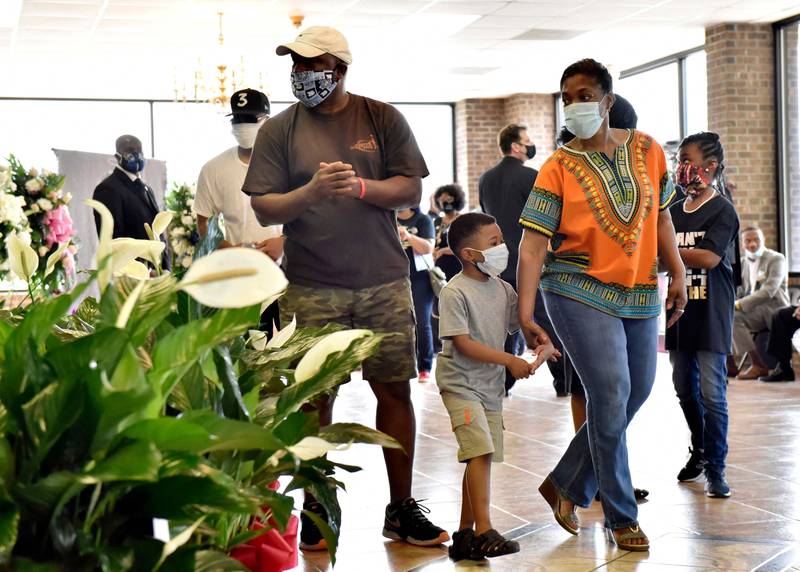 People pay their respects during a memorial service for George Floyd, Saturday, June 6, 2020, in Raeford, N.C. Floyd died after being restrained by Minneapolis police officers on May 25.  (Ed Clemente/The Fayetteville Observer via AP, Pool)