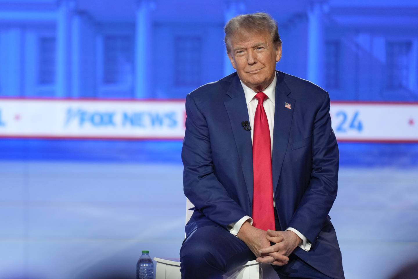 Republican presidential candidate former President Donald Trump listens during a Fox News Channel town hall in Des Moines, Iowa, Wednesday, Jan. 10, 2024. (AP Photo/Carolyn Kaster)