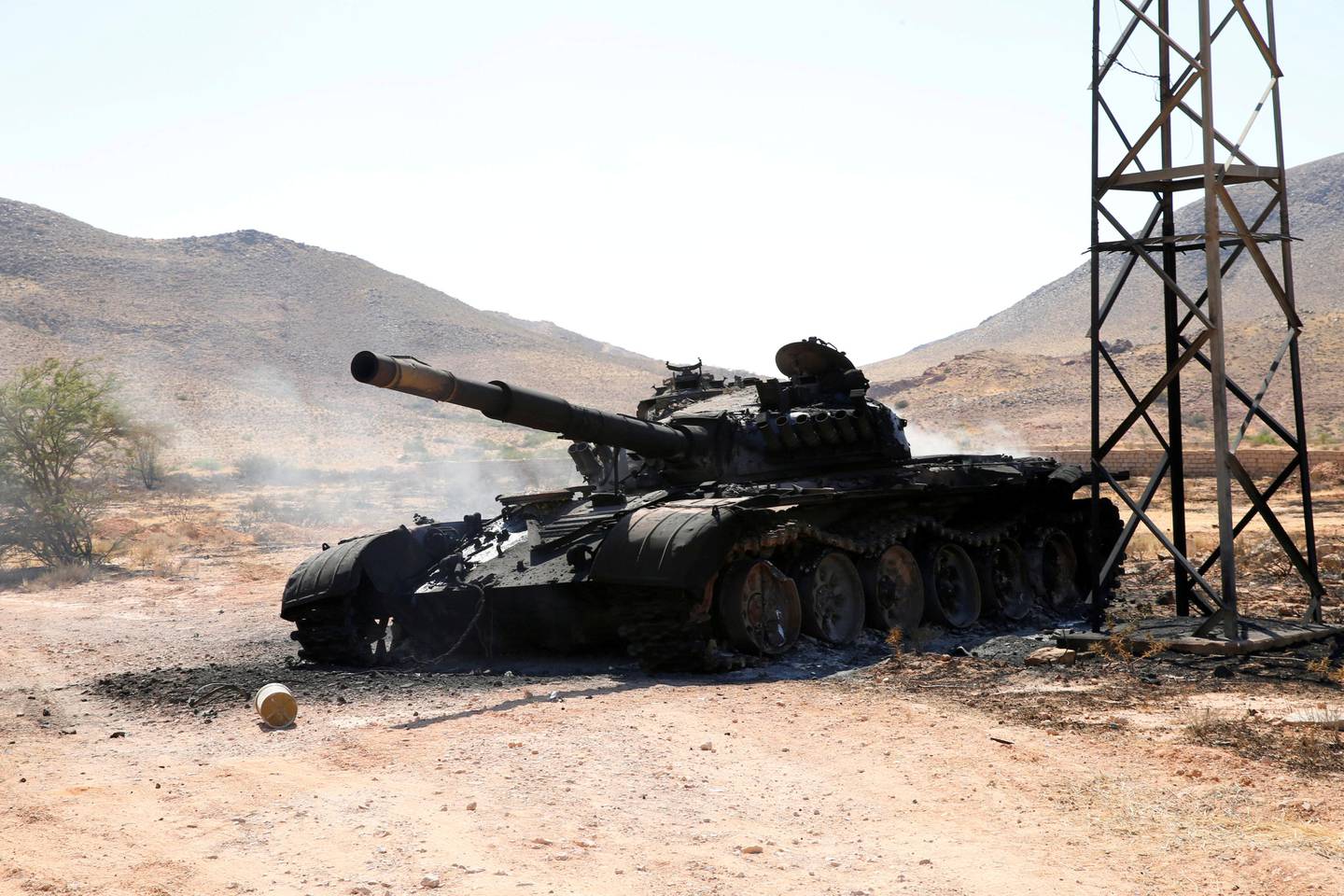 REFILE - CORRECTING GRAMMAR A destroyed and burnt tank, that belongs to the eastern forces led by Khalifa Haftar, is seen in Gharyan south of Tripoli Libya June 27, 2019. REUTERS/Ismail Zitouny