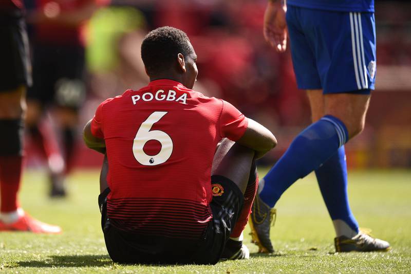 Manchester United's French midfielder Paul Pogba sits during the English Premier League football match between Manchester United and Cardiff City at Old Trafford in Manchester, north west England, on May 12, 2019. (Photo by Oli SCARFF / AFP) / RESTRICTED TO EDITORIAL USE. No use with unauthorized audio, video, data, fixture lists, club/league logos or 'live' services. Online in-match use limited to 120 images. An additional 40 images may be used in extra time. No video emulation. Social media in-match use limited to 120 images. An additional 40 images may be used in extra time. No use in betting publications, games or single club/league/player publications. / 
