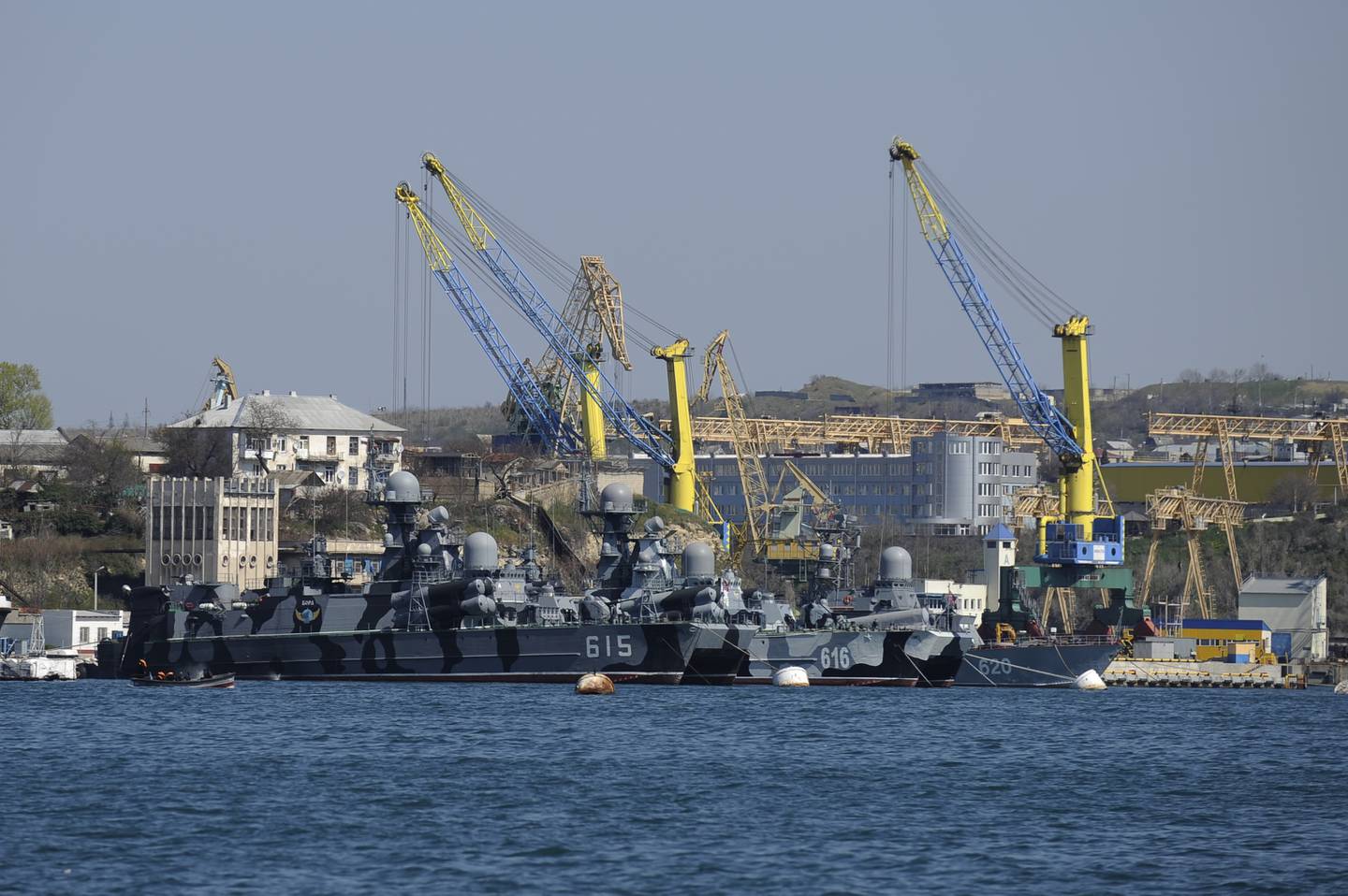 Russian Black Sea fleet ships are anchored in one of the bays of Sevastopol, Crimea, Monday, March 31, 2014. In Moscow, the lower house of parliament voted unanimously Monday to annul agreements with Ukraine on Russia's navy base in Crimea. In 2010, Ukraine allowed Russia to extend the lease of the fleet's base until 2042 on an annual rent of $98 million and price discounts for Russian natural gas supplies. (AP Photo/Andrew Lubimov)