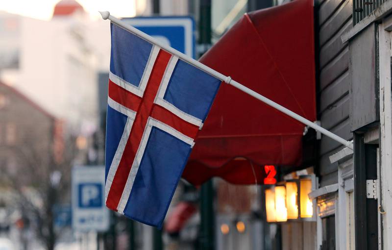 FILE - In this Thursday, Oct. 27, 2016 file photo, an Icelandic flag hangs outside a shop in Reykjavik. The island nation of Iceland says it is taking legal action against British frozen-food chain Iceland over the right to use their shared name. Iceland's Ministry of Foreign Affairs says it has challenged Iceland Foods at the European Union Intellectual Property Office. It says it is acting because the retail chain "aggressively pursued" Icelandic companies using the word Iceland in their branding. In a statement on Thursday, Nov. 24 it says the situation has left the country's firms "unable to describe their products as Icelandic." (AP Photo/Frank Augstein, file)
