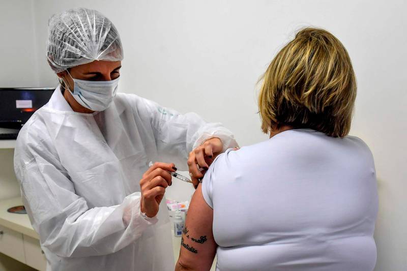 Brazilian pediatric doctor Monica Levi, one of the volunteers who received the COVID-19 vaccine, works at the Specialized Clinic in Infectious and Parasitic Diseases and Immunizations (CEDIPI), in Sao Paulo, Brazil, on July 24, 2020. - The doctor is one of the 5,000 volunteers participating in Brazil of the phase 3 trials - the last before homologation - of the ChAdOx1 nCoV-19 vaccine, developed by the University of Oxford together with the British pharmaceutical company AstraZeneca. (Photo by NELSON ALMEIDA / AFP)