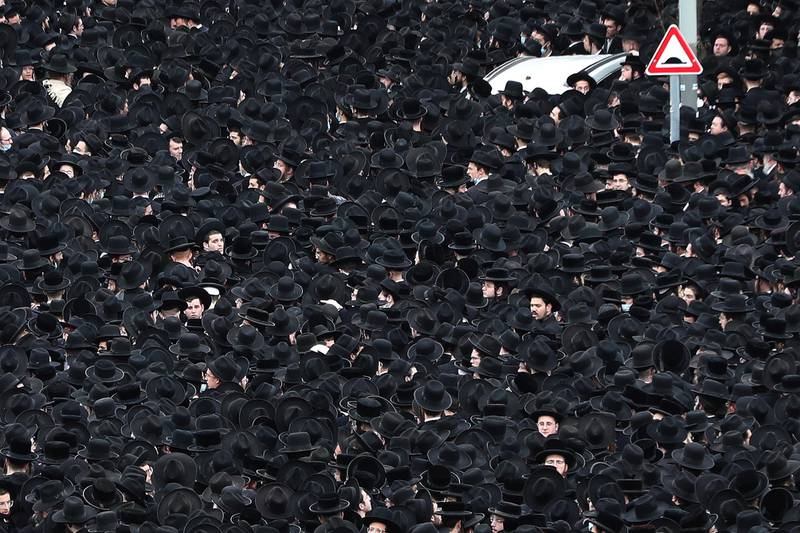 Ultra Orthodox Jews take part in a funeral of a Jewish spiritual leader amid the coronavirus disease (COVID-19) restrictions in Jerusalem January 31, 2021. REUTERS/Ronen Zvulun