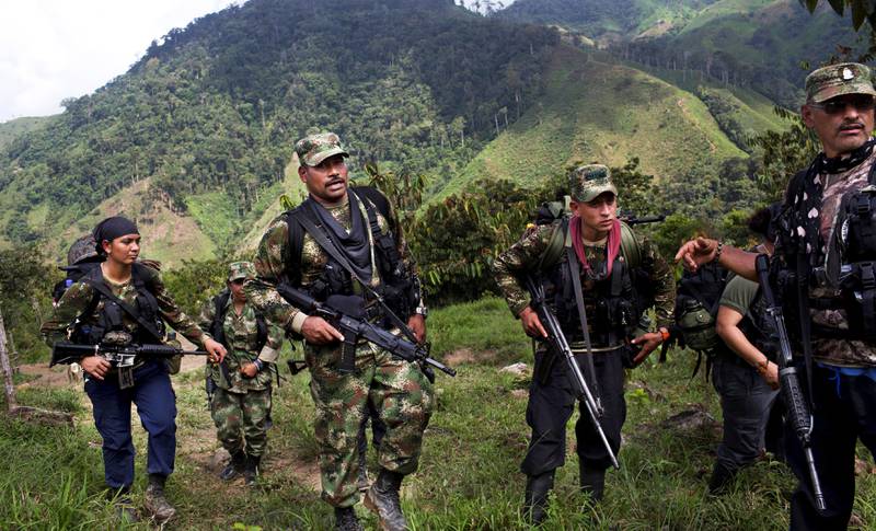 Soldater fra FARC-geriljaen vil ha garantier for egen sikkerhet hvis de leverer fra seg våpnene. Det er håp om våpenhvile innen 21. mars, da Barack Obama besøker Cuba. FOTO: RODRIGO ABD/NTB SCANPIX