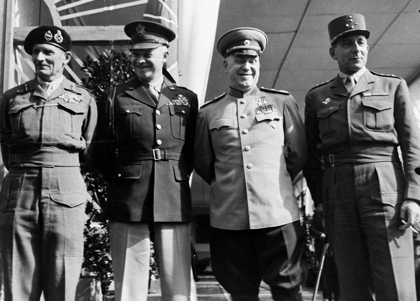 From left, Britain's Field Marshal Bernard Montgomery, U.S. Gen. Dwight D. Eisenhower, Soviet Marshal Georgy Zhukov, and France's Gen. Jean de Lattre de Tassigny, stand outside Soviet headquarters, a riverside club, in Berlin, Germany, June 5, 1945, prior to a meeting of the Allied Control Commission where a pact, in which the four Allied powers reaffirm the complete defeat of Germany and assume authority over all aspects of life in the country, will be signed. Both the country and Berlin will be divided into four occupation zones and sectors, with the national borders reverting to those of December 31, 1937.  (AP Photo/Henry L. Griffin)
