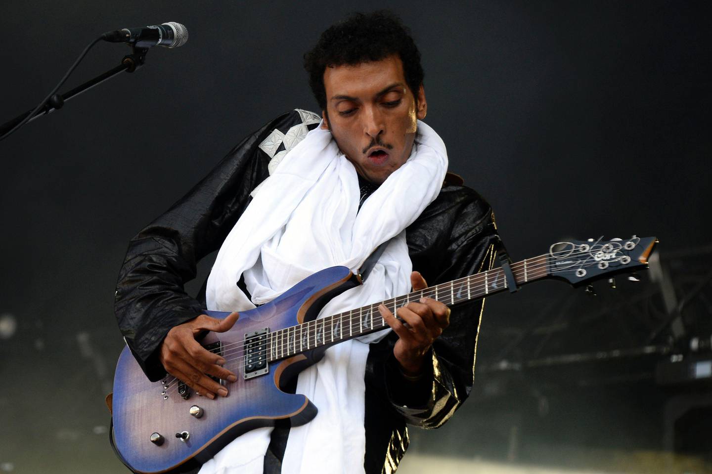 Tuareg guitarist and singer from Niger Omara Moctar alias "Bombino", performs during the Rock en Seine music festival in Saint-Cloud near Paris on August 26, 2016.  / AFP PHOTO / BERTRAND GUAY