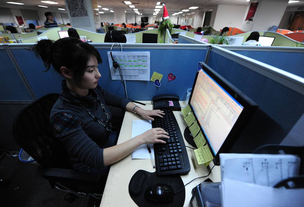 To go with AFP story by Dan Martin: LIFESTYLE-CHINA-VALENTINE-INTERNET
A woman works her keyboard looking at the screen in her office cubicle at an online dating website in Beijing on February 4, 2010. Cybersearching to find a partner is revolutionising how Chinese interact with the opposite sex, say users and experts, with state media reports having quoted estimates of online dating accounts in the hundreds of millions, and in a 2008 report aBeijing-based Internet research firm said China's online dating market was worth 44 million dollars that year and would surge past 100 million in 2011. AFP PHOTO/Frederic J. BROWN