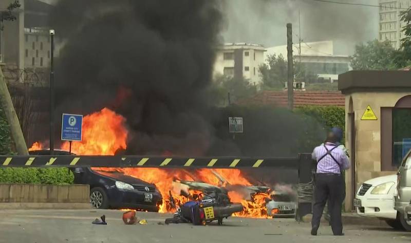 This frame taken from video shows a scene of an explosion in Kenya's capital, Nairobi, Tuesday Jan. 15, 2019. Gunfire and explosions were reported near an upscale hotel complex. (AP Photo/Josphat Kasire)