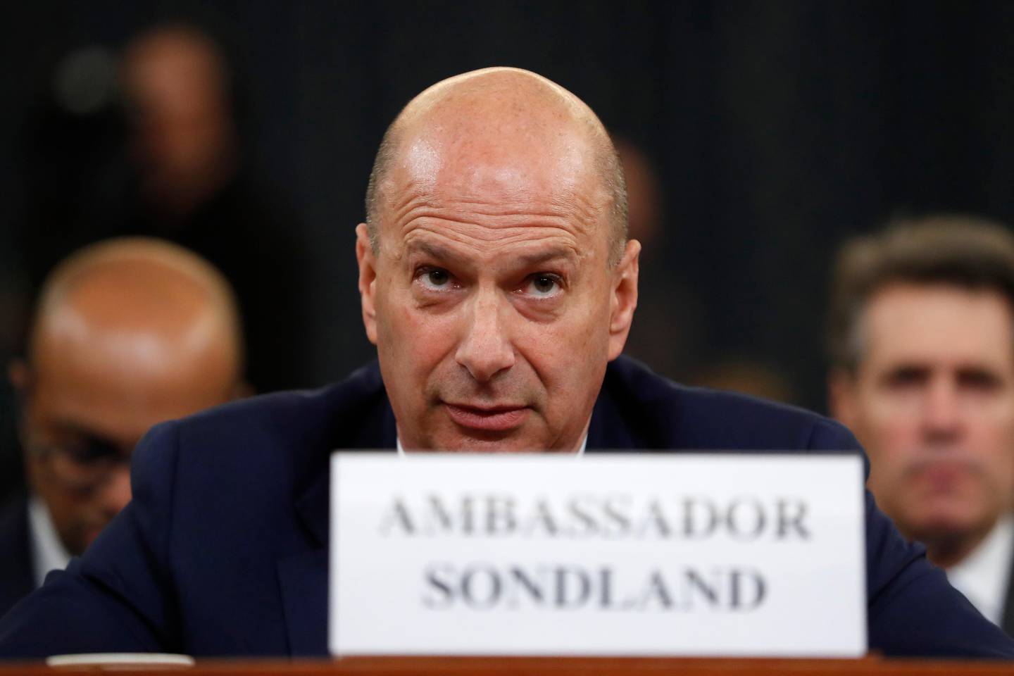 U.S. Ambassador to the European Union Gordon Sondland listens to the closing statement of House Intelligence Committee Chairman Adam Schiff, D-Calif., before the House Intelligence Committee on Capitol Hill in Washington, Wednesday, Nov. 20, 2019, during a public impeachment hearing of President Donald Trump's efforts to tie U.S. aid for Ukraine to investigations of his political opponents. (AP Photo/Andrew Harnik)