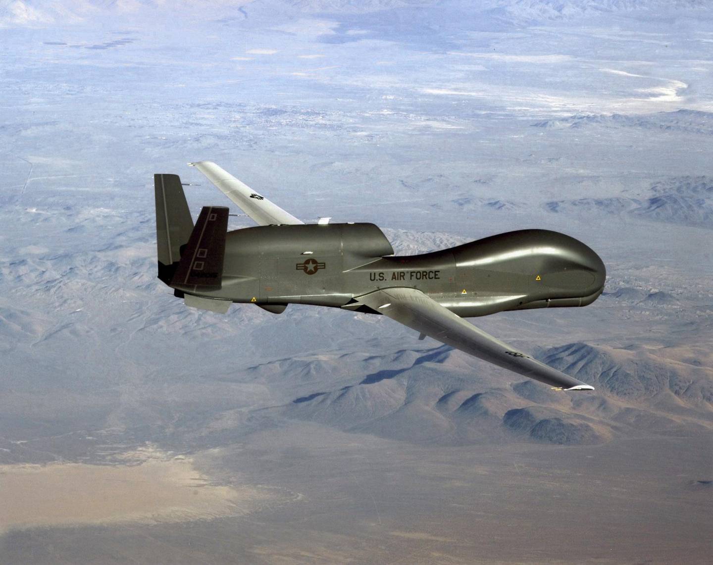 TOPSHOT - This undated US Air Force file photo released on June 20, 2019 shows a photo of a RQ-4 Global Hawk unmanned surveillance and reconnaissance aircraft. - A US spy drone was some 34 kilometers (21 miles) from the nearest point in Iran when it was shot down over the Strait of Hormuz by an Iranian surface-to-air missile June 20, 2019, a US general said. "This dangerous and escalatory attack was irresponsible and occurred in the vicinity of established air corridors between Dubai, UAE, and Oman, possibly endangering innocent civilians," said Lieutenant General Joseph Guastella, who commands US air forces in the region."At the time of the intercept the RQ-4 was at high altitude, approximately 34 kilometers from the nearest point of land on the Iranian coast," he said, over a video to the Pentagon press briefing room. (Photo by Handout / US AIR FORCE / AFP) / RESTRICTED TO EDITORIAL USE - MANDATORY CREDIT "AFP PHOTO / US AIR FORCE/HANDOUT" - NO MARKETING - NO ADVERTISING CAMPAIGNS - DISTRIBUTED AS A SERVICE TO CLIENTS
