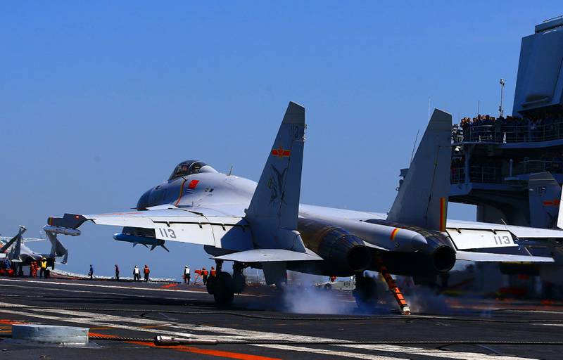 This photo taken on April 24, 2018 shows a J15 fighter jet landing on China's sole operational aircraft carrier, the Liaoning, during a drill at sea.
A flotilla of Chinese naval vessels held a "live combat drill" in the East China Sea, state media reported early April 23, 2018, the latest show of force by Beijing's burgeoning navy in disputed waters that have riled neighbours. / AFP PHOTO / - / China OUT