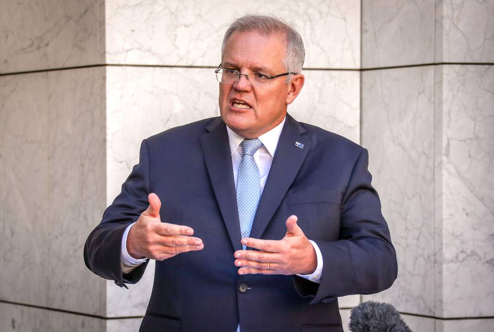 Australian Prime Minister Scott Morrison speaks during a press conference at Australia's Parliament House in Canberra on March 22, 2020. - Morrison told citizens to cancel any domestic travel plans to slow the spread of coronavirus, warning stronger measures were imminent to deal with localised outbreaks. (Photo by DAVID GRAY / AFP)