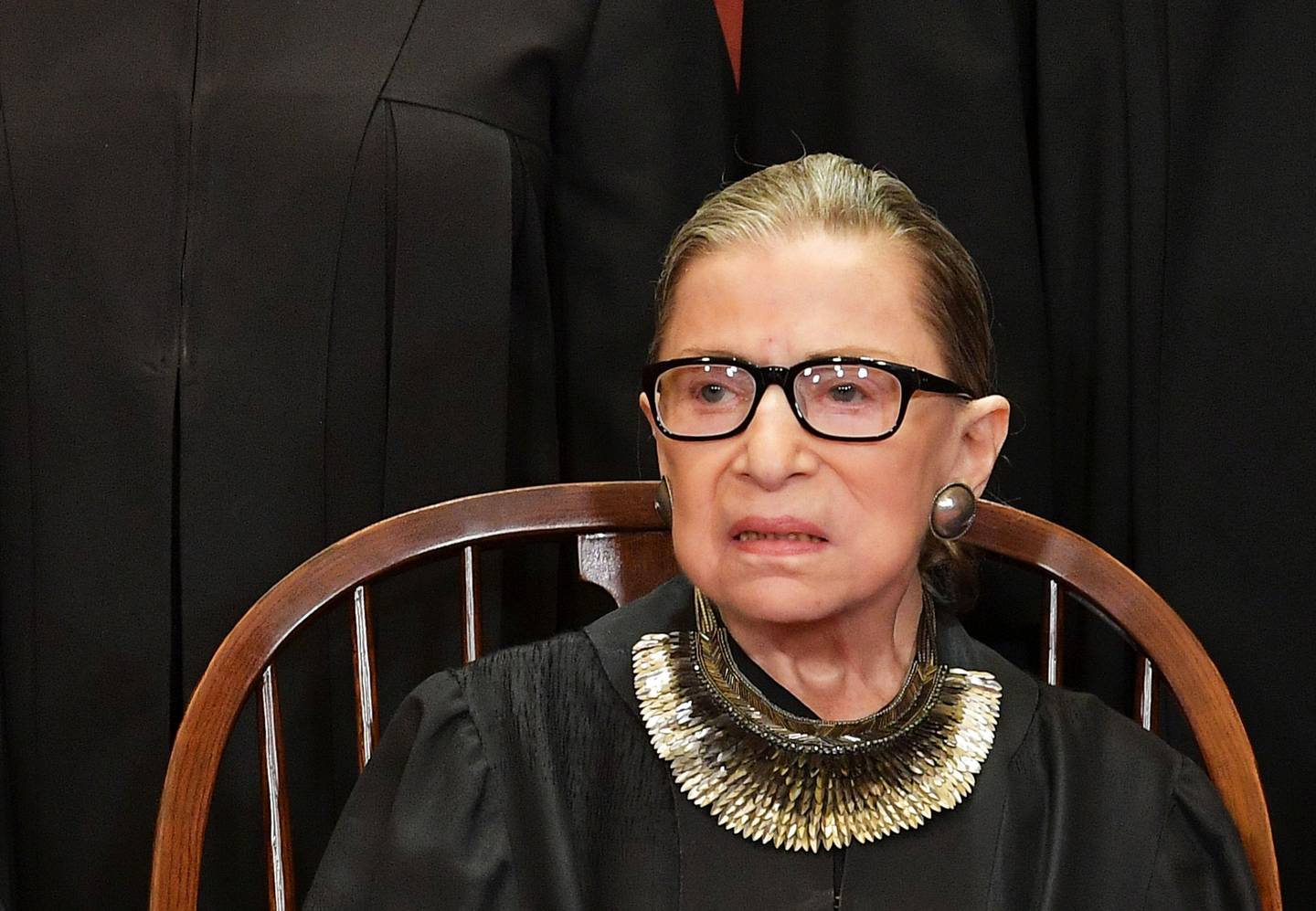 (FILES) In this file photo taken on November 30, 2018 Associate Justice Ruth Bader Ginsburg poses for the official photo at the Supreme Court in Washington, DC. - Progressive icon and doyenne of the US Supreme Court, Ruth Bader Ginsburg, has died at the age of 87 after a battle with pancreatic cancer, the court announced on September 18, 2020. Ginsburg, affectionately known as the Notorious RBG, passed away "this evening surrounded by her family at her home in Washington, DC," the court said in a statement. (Photo by MANDEL NGAN / AFP)