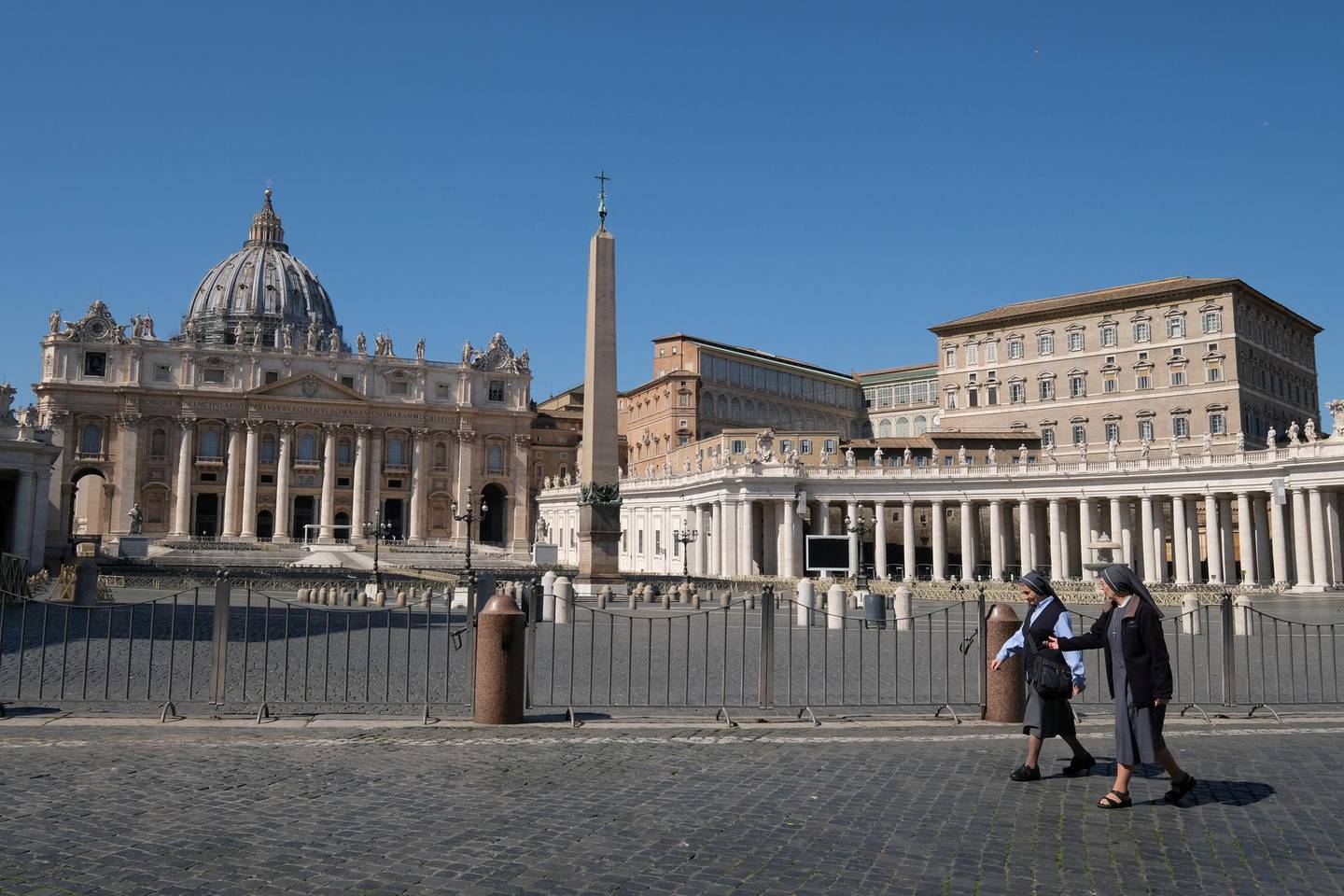 FILE PHOTO: Nuns walk past a deserted St Peter's Square on the seventh day of a lockdown due to the coronavirus in Rome, Italy, March 16, 2020. REUTERS/Crispian BalmerTwo nuns walk past a deserted St Peter’s Square/File Photo
