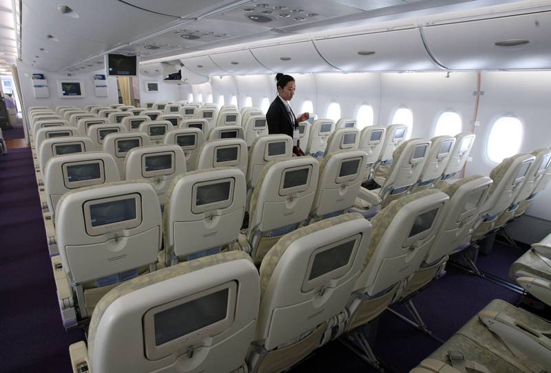 An economy class cabin on the new Airbus A380 superjumbo airliner that is on display at the Pudong Airport in Shanghai, 25 October 2007.  The new plane has a "wow factor" that premium airlines hope will help them see off the challenge from low-cost rivals, aviation analysts say. Singapore Airlines (SIA) scored a coup over Qantas by staging the giant aircraft's first commercial flight on 25 October in the Sydney backyard of its Australian arch rival, which will not receive its own A380s until mid-2008.    AFP PHOTO/Mark RALSTON