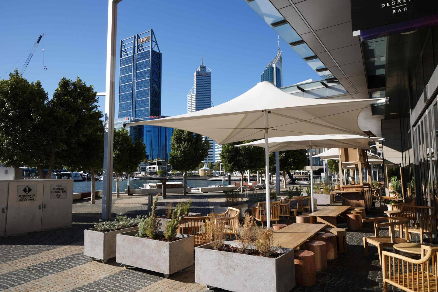 A general view shows an empty restaurant in the normally busy Elizabeth Quay area in Perth on January 31, 2021, as authorities announced a snap five-day lockdown after a security guard at a quarantine hotel tested positive for Covid-19 ending Western Australia's ten month coronavirus-free streak. (Photo by TREVOR COLLENS / AFP)